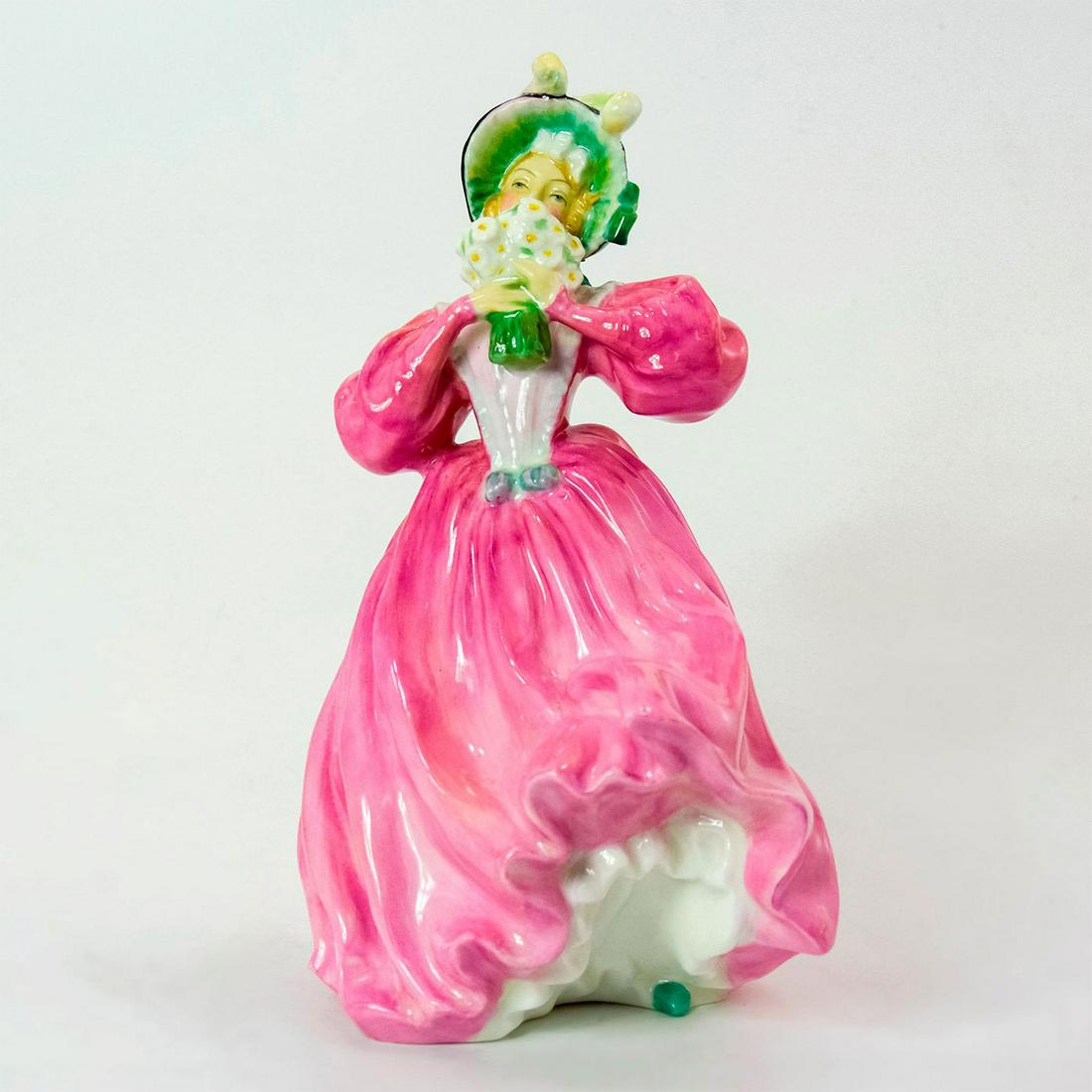 Marguerite HN1928 - Royal Doulton Figurine: Bone China. Lady wearing a pink dress and black and green bonnet, holding a bouquet by her face. Series: Harradine Classics. Royal Doulton backstamp. Artist: Leslie Harradine Issued: 1940-1959 Dimensi
