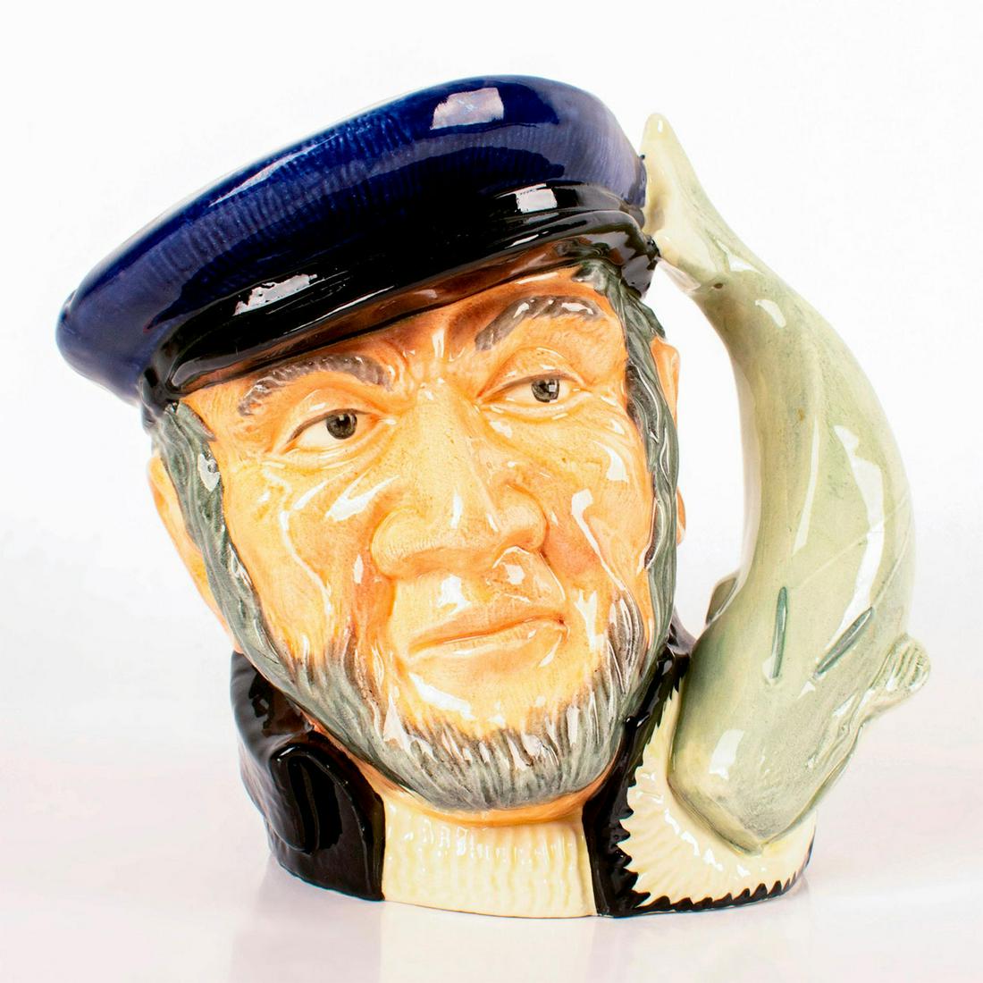Capt Ahab D6500 - Large - Royal Doulton Character Jug: Blue cap, black coat, white sweater. Captain Ahab sailed the whaler, Pequod, in Herman Melville's great 19th century American classic, "Moby Dick". He lost a leg and then his life in pursuit of the gr