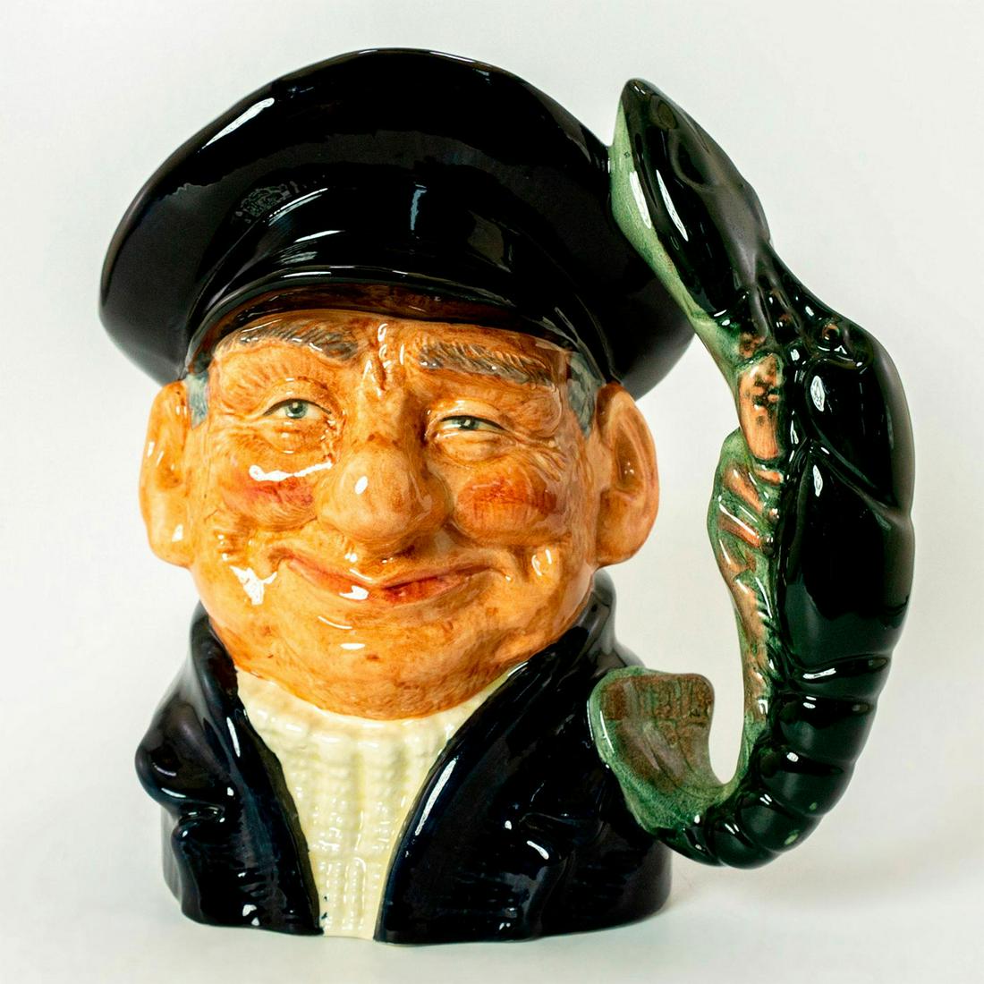 Lobsterman D6617 - Large - Royal Doulton Character Jug: Variation One: Dark blue jacket and cap, white fisherman's jersey. Royal Doulton backstamp. Good condition. Artist: David B. Biggs Issued: 1968 - 1991 Dimensions: 7.5"H Manufacturer: Royal Doulton Cou
