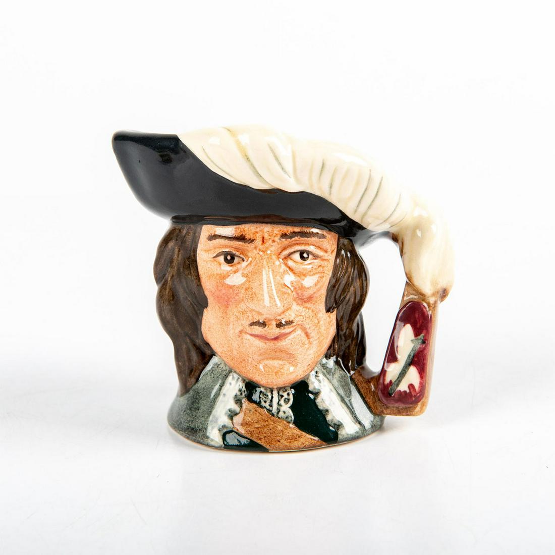 D Artagnan D6765 - Mini - Royal Doulton Character Jug: Black hat trimmed with white feathers; white lace collar. A character in Alexandre Dumas' lively 19th-century fiction. D'Artagnan came to Paris to join the celebrated band of Three Musketeers and shar