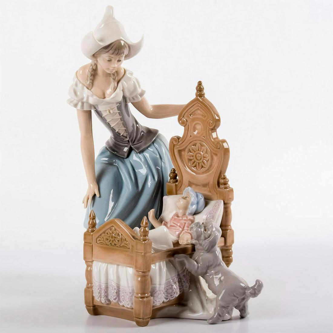 Dutch Mother 1005083 - Lladro Porcelain Figurine: Mother in blue gray bending over baby crib with little dog. Lladro backstamp. No box. Artist: Salvador Debon Issued: 1980-1983 Dimensions: 11.75"H Manufacturer: Lladro Country of Origin: Spain