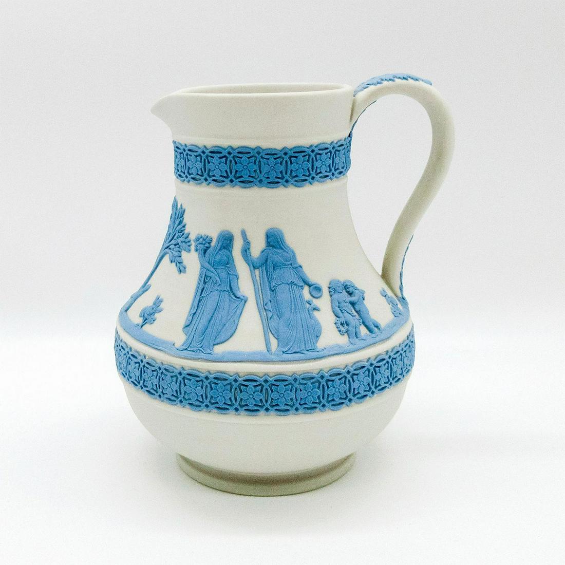 Wedgwood Blue On Cream Jasperware Jug: Pale blue relief neoclassical design encircling body on cream color jasperware ground. Wedgwood impressed backstamp. #jug #pitcher Issued: 20th c. Dimensions: 5"H Manufacturer: Wedgwood Country of Ori