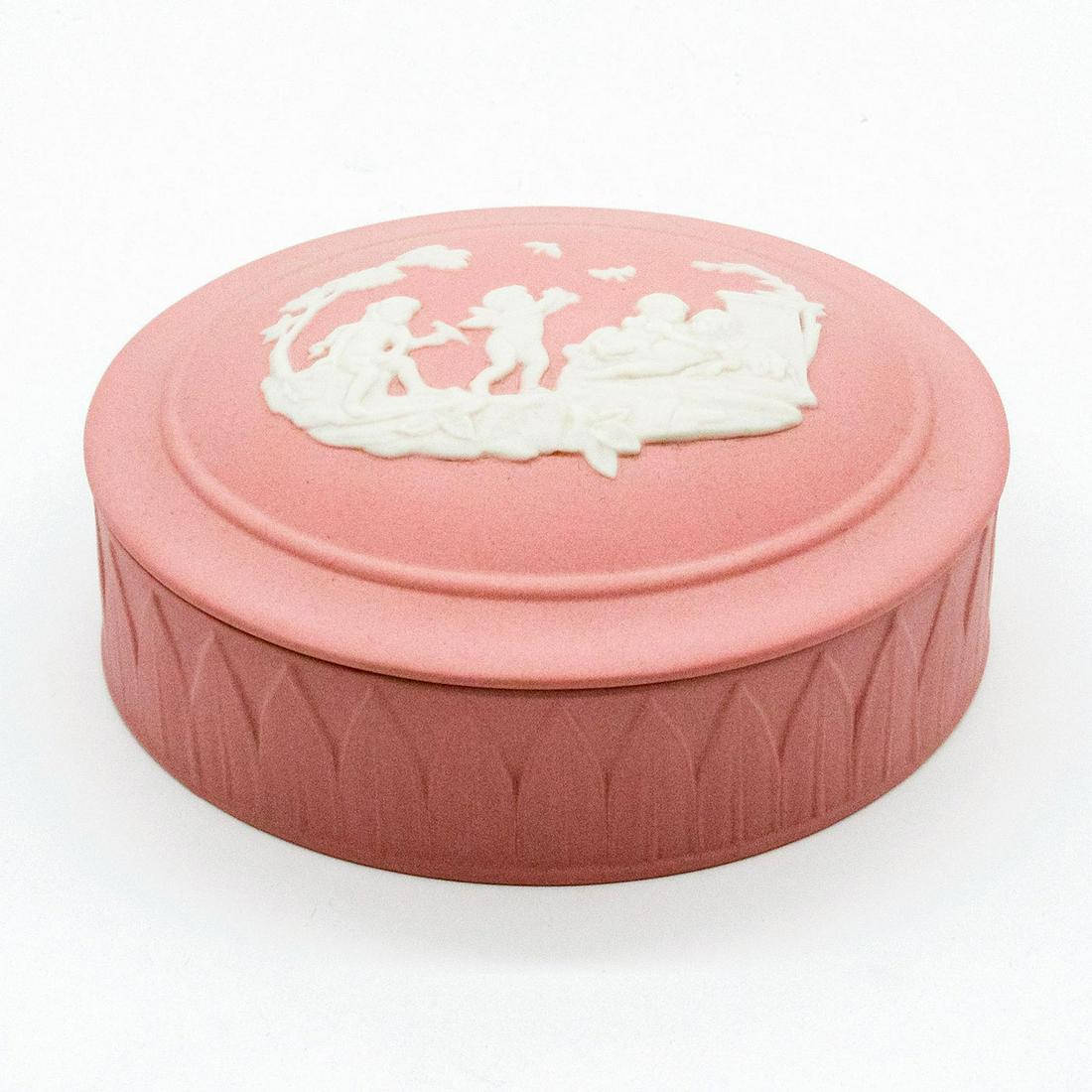 Wedgwood Pink Jasperware Oval Trinket Box: Removable lid; cream colored decoration in relief depicting a group of playful cherubs. Wedgwood impressed backstamp. Good condition. #wedgwood #jasperware #pink #box #cherub Issued: 20th c. Dimension