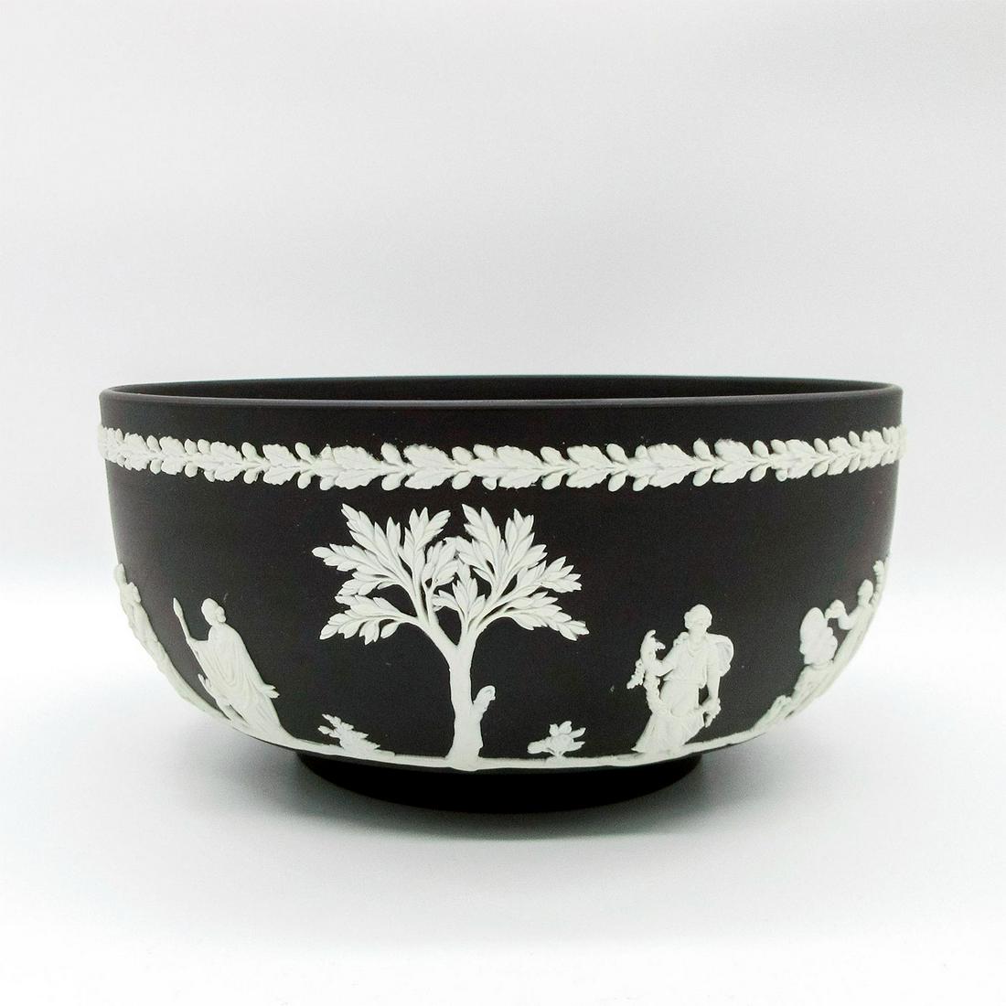 Wedgwood White On Black Jasperware Bowl: Matte black bowl with white relief neoclassical designs encircling body. Wedgwood impressed backstamp. #bowl Issued: 20th c. Dimensions: 3.5"H x 7.5" dia Manufacturer: Wedgwood Country of Origin: Engl