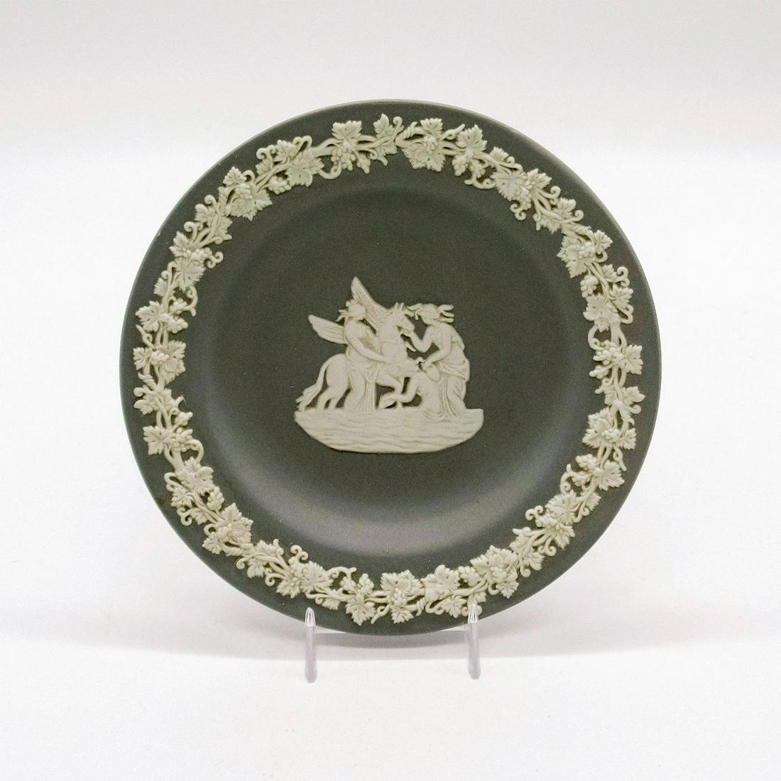 Wedgwood Grey Jasperware Round Tray, Pegasus: Cream colored decorations in relief depicting The Muses bathing Pegasus. Wedgwood impressed backstamp. Age related wear. #wedgwood #jasperware #tray #pegasus Issued: 20th c. Dimensions: 4.5" dia. Manu