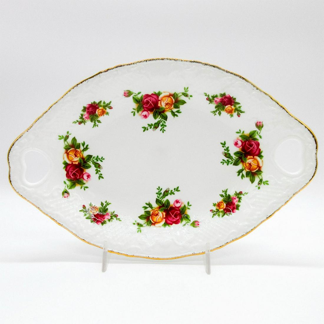 Royal Albert Bone China Tray, Old Country Roses: Heart shaped pierced handled tray. Glazed ceramic tray; Old Country Roses pattern; gilt rim. Royal Albert backstamp. #tray Issued: 20th c. Dimensions: 9.5"W Manufacturer: Royal Albert Country of Origi