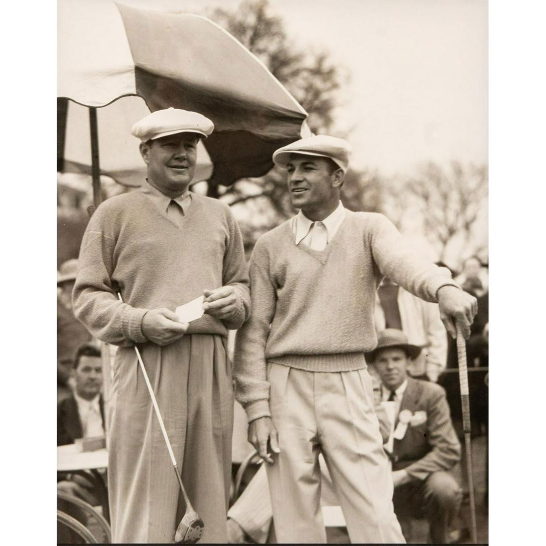 Black and White Photography, 1942 Masters: Black wood frame. Photograph of Byron Nelson and Ben Hogan in 1942 Masters. No photographer signature. Some visible scratches on frame. Sight size - 10"H x 8"W. Frame size - 15.25"H x 17.25"W. Issued: