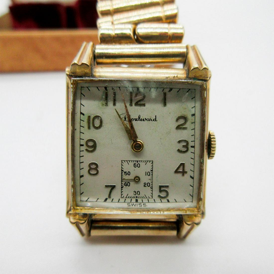 Vintage Boulevard Watch in Gold: A vintage Boulevard women's watch in original box. Watch face is 1" X 1", Watch is in working condition. Issued: 1950 Manufacturer: Boulevard Country of Origin: Switzerland