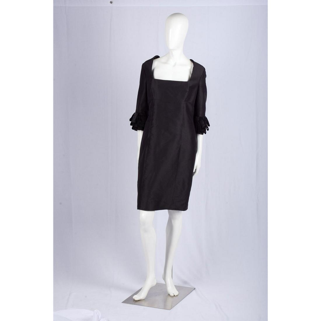 Escada Black Silk Dress: US size 12. Fabric 100% silk. Lining 100% cupro. Zipper runs down back, fluffle sleeves. Escada tag attached. Waist: 33". Hips: 42". Sleeve length: 16". Good condition. #escada #black #silk #dress Man