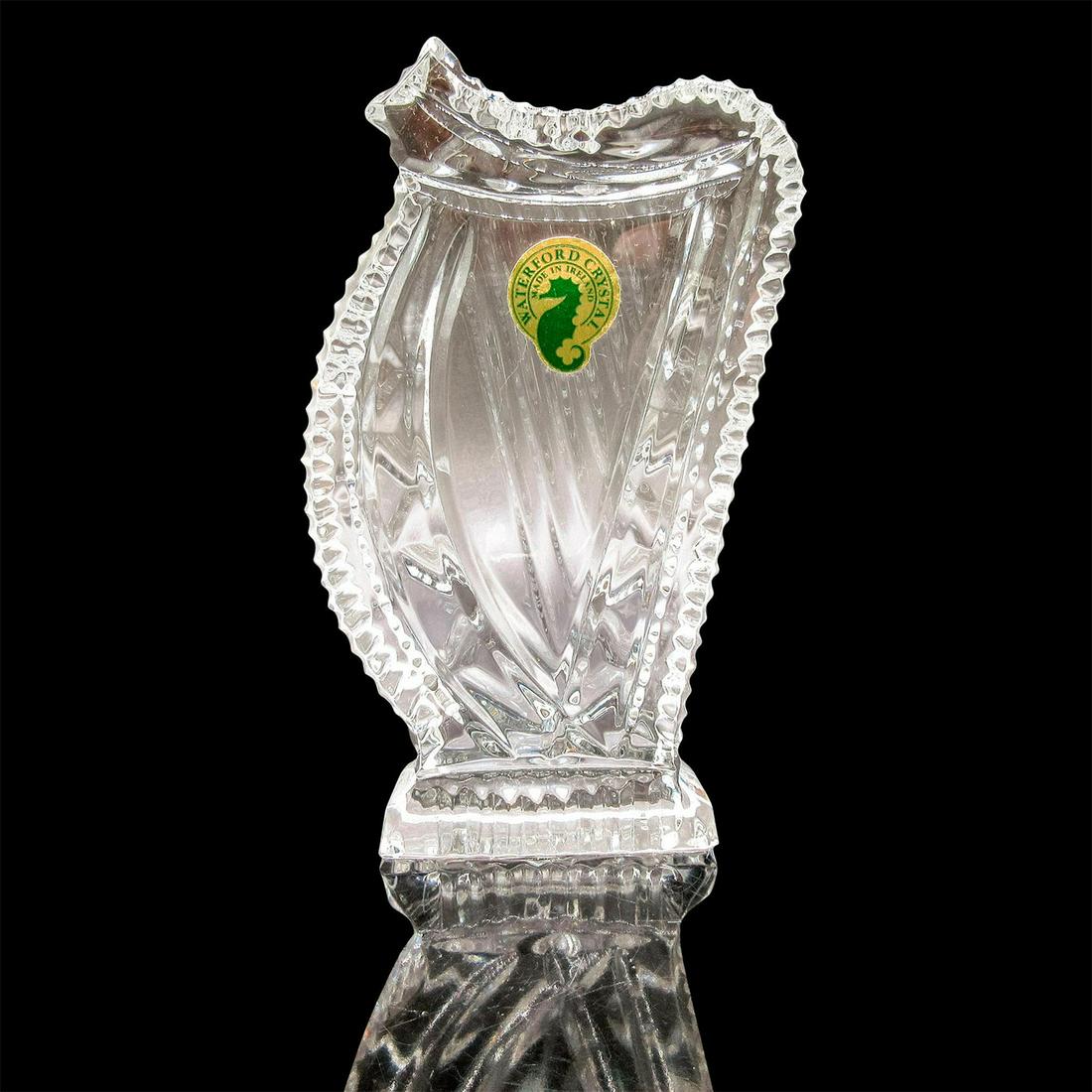 Waterford Lead Crystal Harp Paperweight: Clear crystal harp shaped edged paperweight. Waterford edged in glass on the bottom. Original sticker on the front. #waterford #instrument #harp #paperweight Issued: 20th c. Dimensions: 2.5"H Manufact