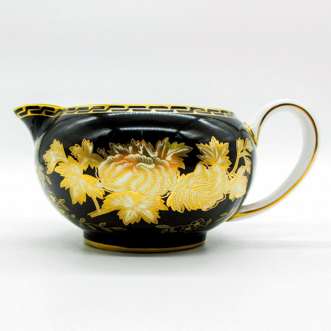 Wedgwood Tonquin Black and Gold, Creamer Jug: Bone china creamer; white glossy interior. Gold gilt floral design. Wedgwood backstamp. #wedgwood Issued: 20th c. Dimensions: 5.5"W x 2.5"H Manufacturer: Wedgwood Country of Origin: England