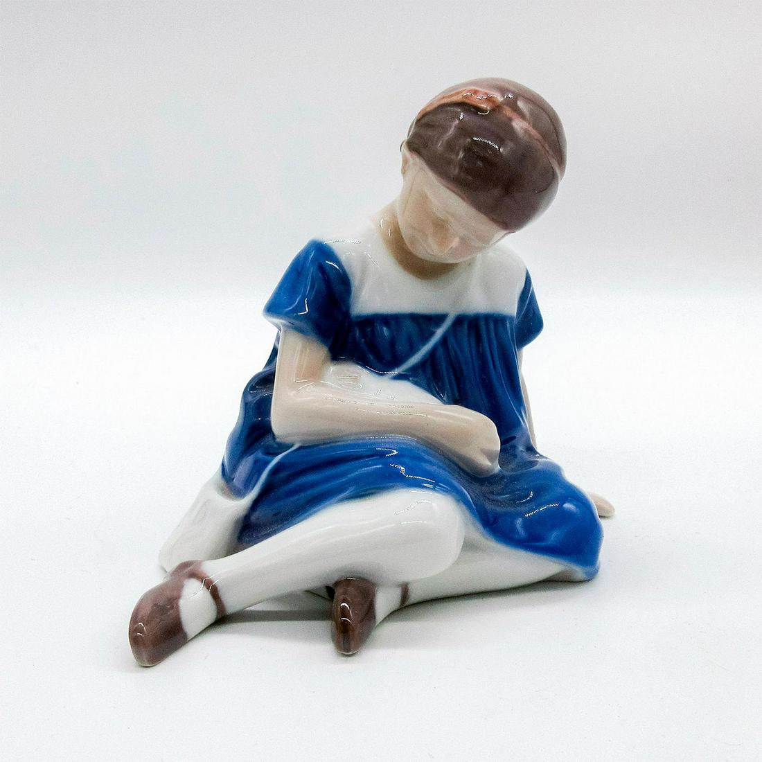 Bing & Grondahl Kjabenhavn Porcelain Figurine: Seated girl in blue dress holding a pet in her arms. Glazed finish. B&G backstamp. #denmark #cat #girl Issued: 20th c. Dimensions: 4"H Manufacturer: B&G Kjï¿½benhavn Denmark Country of Origin: Denm