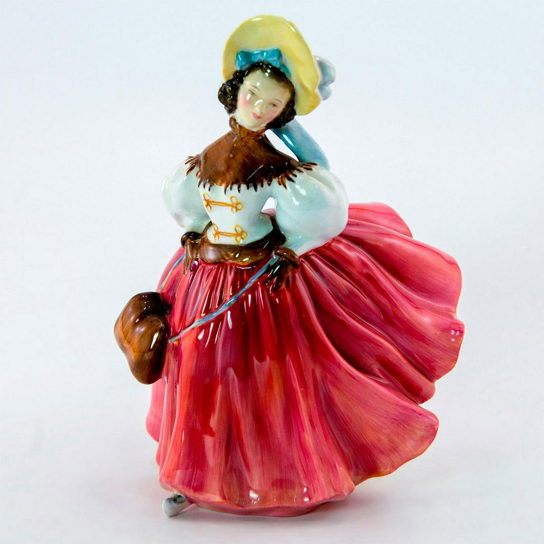 Skater HN2117 - Royal Doulton Figurine: Woman dressed in pink skirt and white/brown blouse. Carrying a brown bag. Royal Doulton backstamp. Artist: Peggy Davies Issued: 1953 - 1971 Dimensions: 7.25"H Manufacturer: Royal Doulton Country of Or