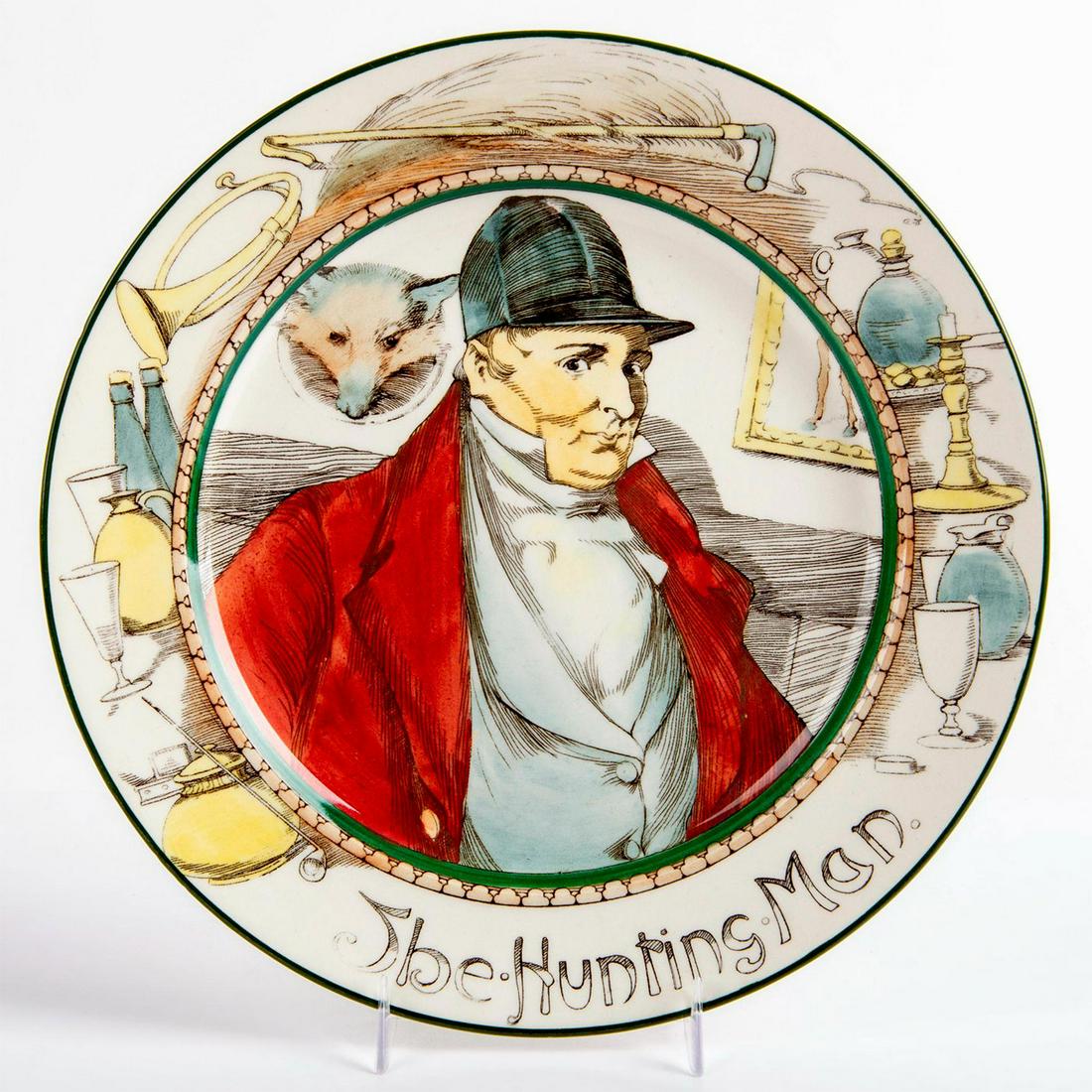 Royal Doulton Rack Plate, The Hunting Man D3349: Professionals series plate. Riding crop and bugle border. Yellow, brown, red and blue coloration. Royal Doulton backstamp. Good condition. #fox #huntsman Issued: 20th c. Dimensions: 10.5" dia. Manufac