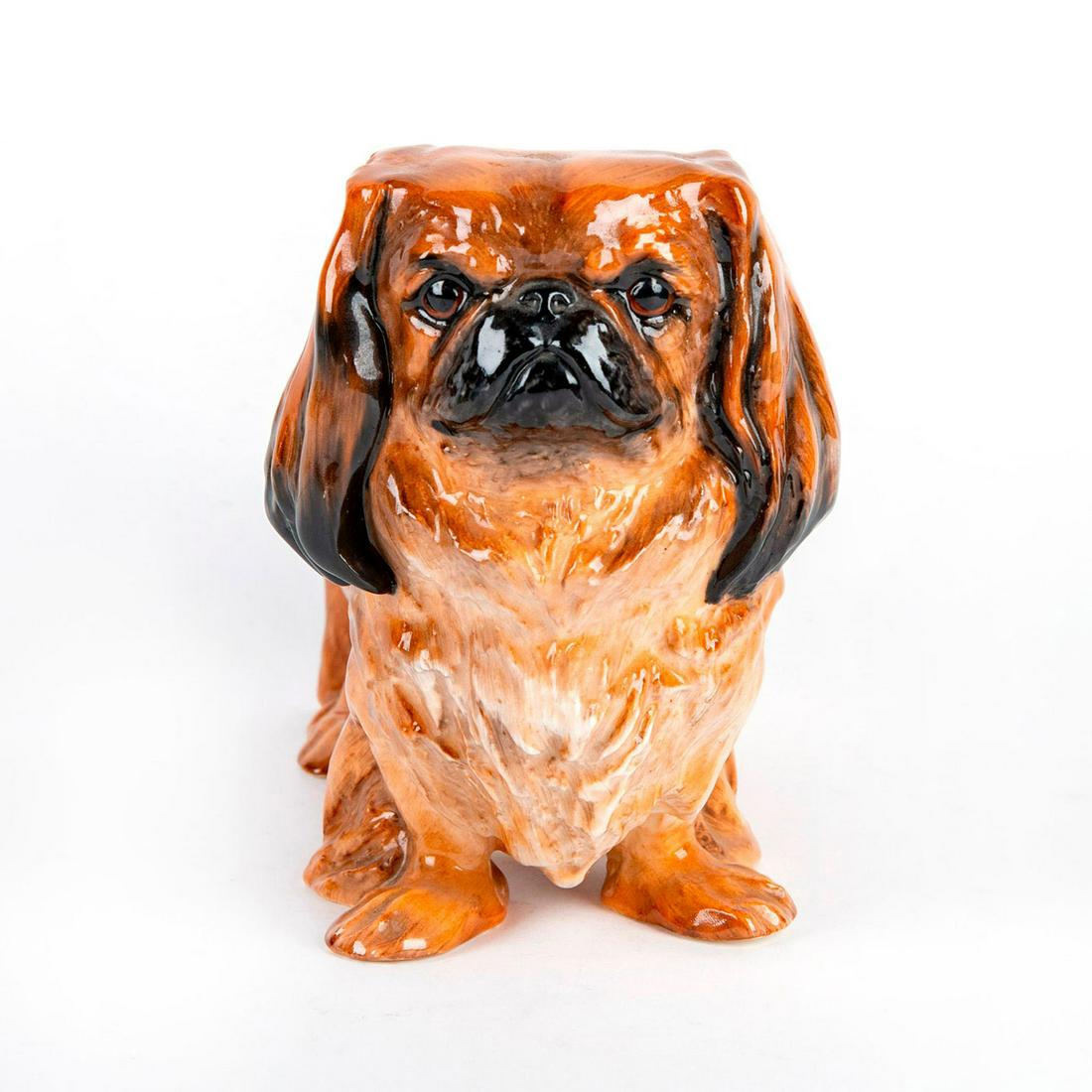 Large Royal Doulton Dog Figurine, Pekinese, Standing HN1011: Modeled as Ch. Biddee of Ifield, hand painted in golden brown with black highlights. Doulton backstamp. Artist: Frederick Daws Issued: 1931-1955 Dimensions: 5.75"H Manufacturer: Royal Doulton Country 