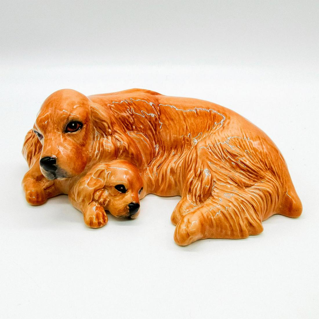 Royal Doulton Figurine, Spaniel and Pup DA174: Dogs and Puppies Series. Golden; glazed finished. Doulton backstamp. #dogs #Spaniel Issued: 20th c. Dimensions: 5"L Manufacturer: Royal Doulton Country of Origin: England
