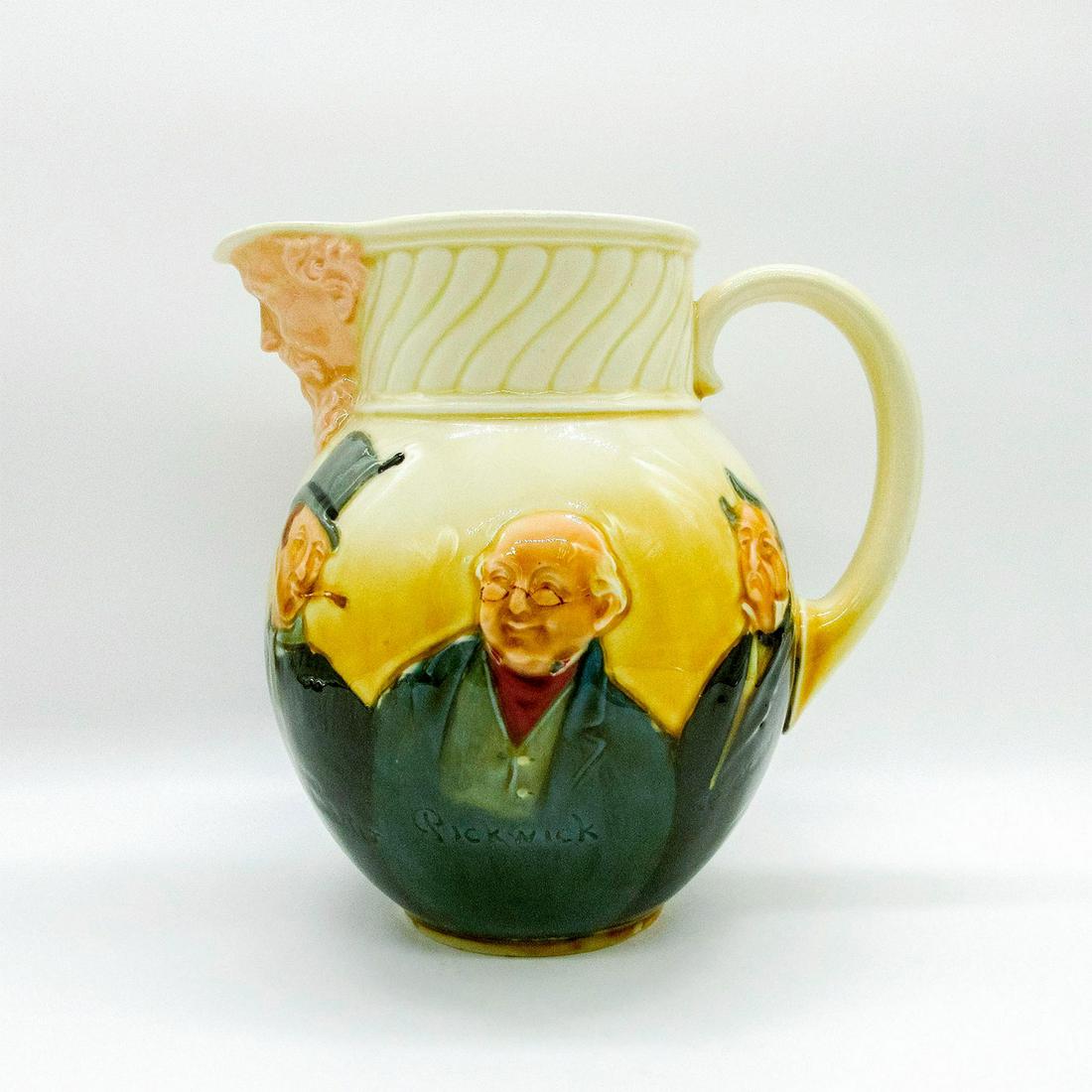 Royal Doulton Queensware Jug, Dickens: Cream and yellow glazed ceramic body; Charles Dickens characters in relief. Includes Sidney Carton, Fagin, Bill Sykes, Sam Weller, Mr Pickwick and Mr Pecksniff. Signed Noke. Doulton backstamp. #jug #p