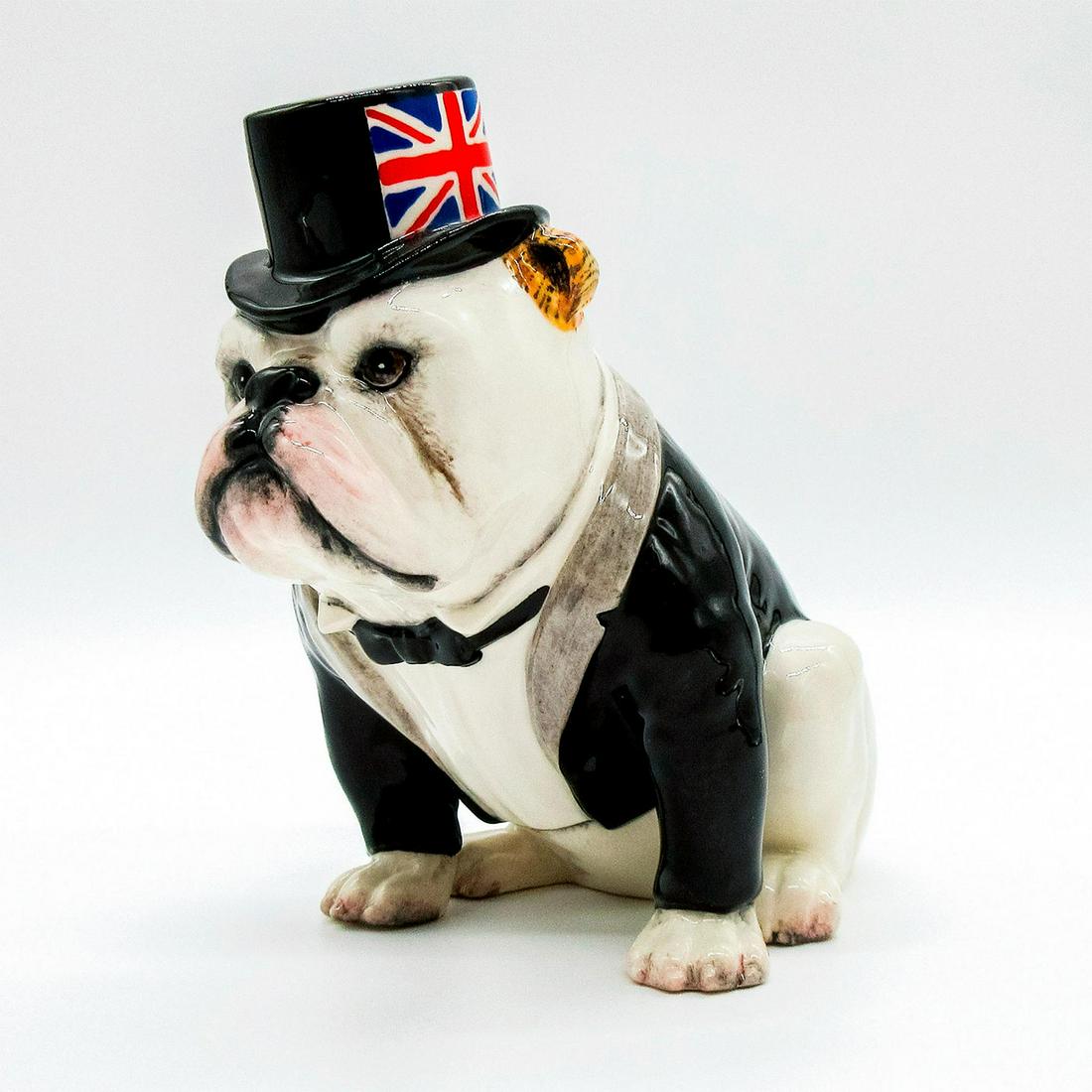 Royal Doulton Animal Figurine, British Bulldog DA228: White bulldog with a black jacket and hat, with the Union Jack flag along the sides. Royal Doulton backstamp. Limited edition of 1000 pieces. Weight: 8.7 oz #royaldoulton #britsh #greatbritain #bulldo