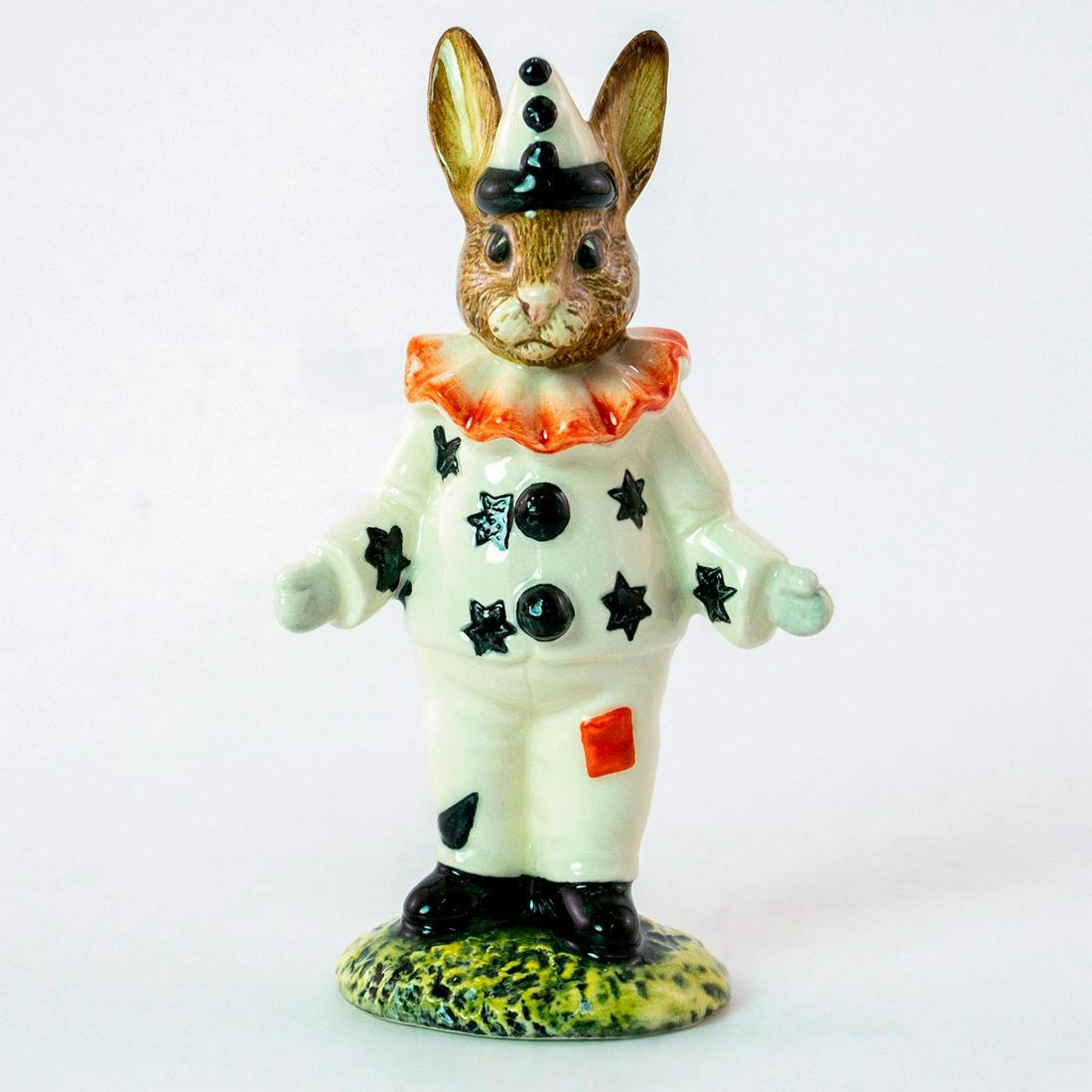 Clown DB128 - Royal Doulton Bunnykins: Limited edition bunny in white clown costume with black stars and black pompons, red square on trousers, red ruff around neck. Royal Doulton backstamp. Weight: 2.1oz Artist: D. Andrews Issued: 1992 Di