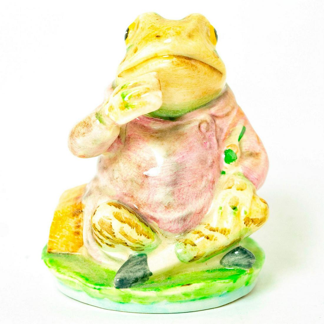 Jeremy Fisher - Beswick - Beatrix Potter Figurine: Green frog sitting cross legged eating a sandwich. Beswick backstamp. Issued: 1975 - 2002 Dimensions: 3"H Manufacturer: Beswick Country of Origin: England
