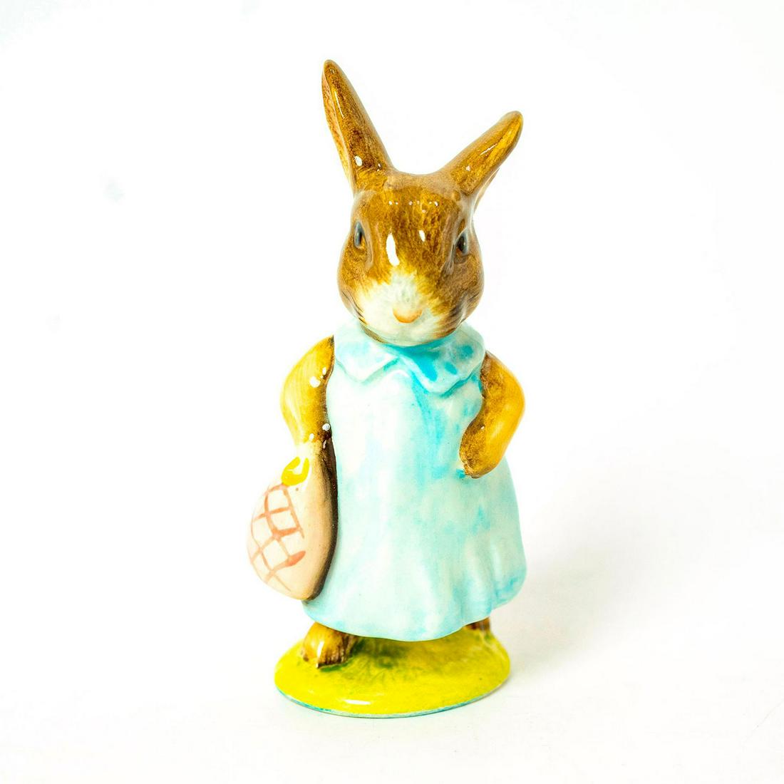 Mrs. Flopsy Bunny - Royal Albert - Beatrix Potter Figurine: Royal Albert Backstamp. Dark/ Light blue dress, pink bag. Artist: Arthur Gredington Issued: 1965 - 1998 Dimensions: 4''H Manufacturer: Beswick Country of Origin: England