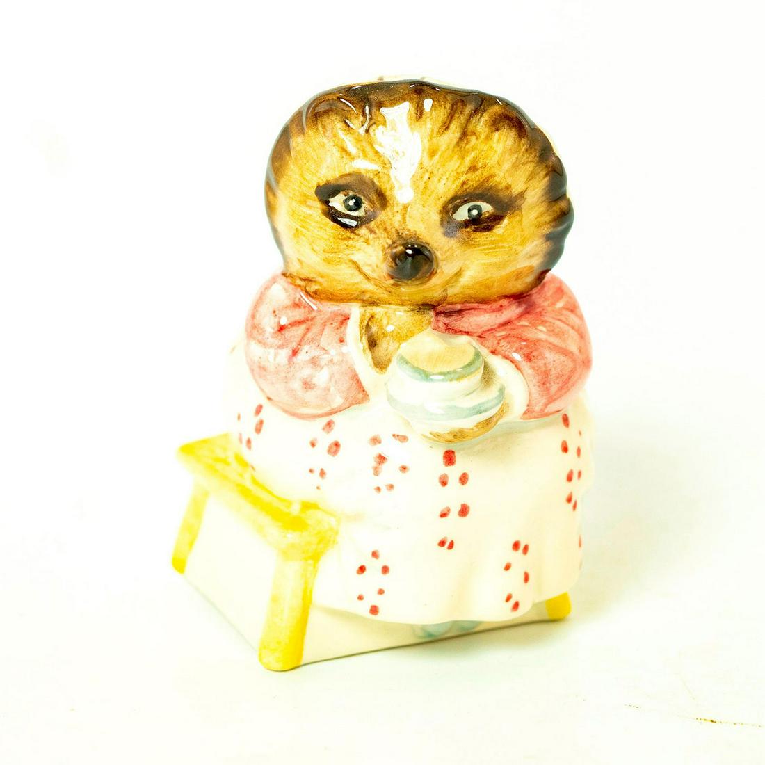 Mrs. Tiggy Winkle Takes Tea - Beswick - Beatrix Potter Figurine: Beswick Backstamp. Pink and white dress, white and brown mob cap. Artist: David Lyttleton Issued: 1985 - 2002 Dimensions: 3.25''H Manufacturer: Beswick Country of Origin: England