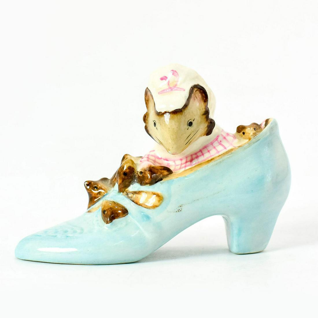 The Old Woman Who Lived in a Shoes - Beatrix Potter Figurine: Adorable mother mouse and her children in a blue high heel shoe. Beswick England marking on the bottom. Good condition. #BeatrixPotter Artist: Colin Melbourne Issued: 1959 - 1998 Dimensions: 3.75"W x