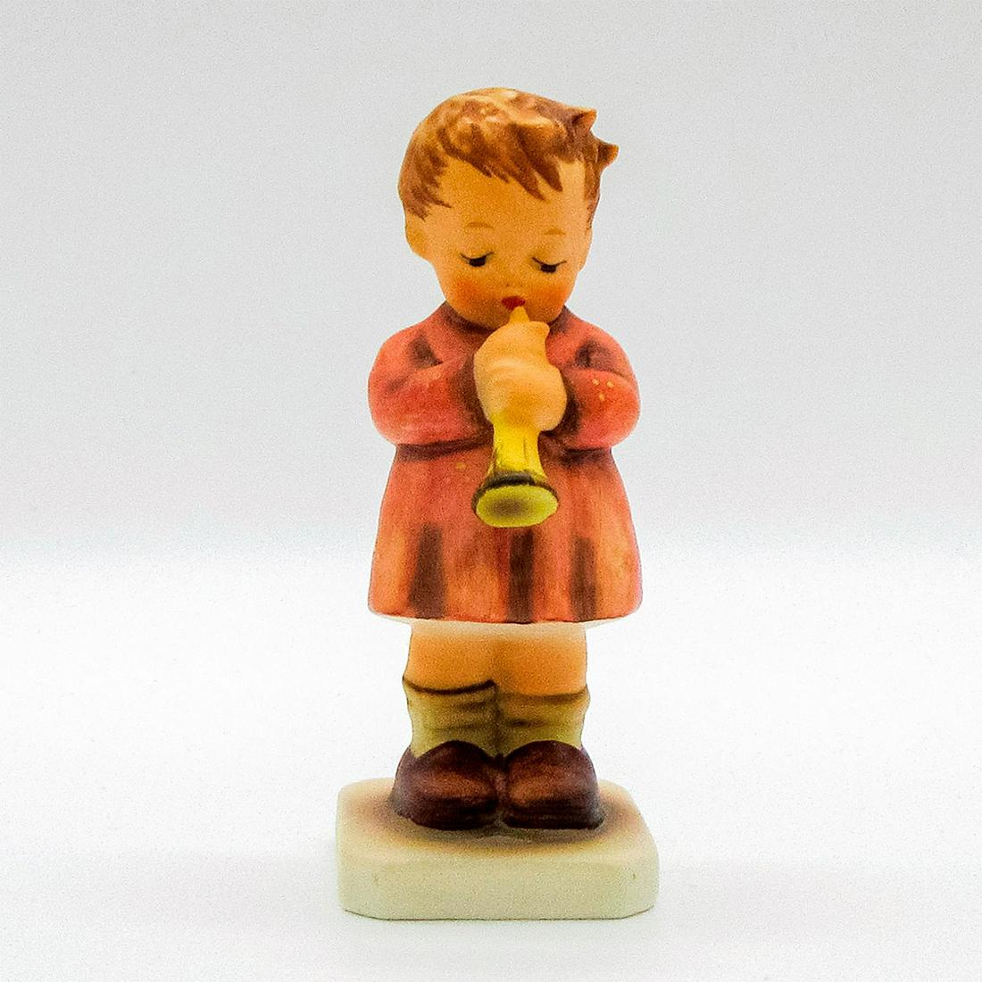 A Budding Maestro 477 - Goebel Hummel Figurine: Hand painted porcelain boy playing his horn. Hand crafted in red smock dress. Goebel backstamp. #goebel #buddingmaestro Issued: 1987 Dimensions: 4"H Manufacturer: Goebel Country of Origin: West German