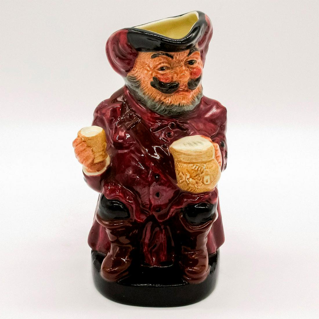 Falstaff (Mug Away) D6063 - Royal Doulton Toby Jug: Variation No. 1. Hand holds mug of ale away from chest. Burgundy clothes, black hat with burgundy feathers. Royal Doulton Sir John Falstaff backstamp. Artist: Charles Noke Issued: 1939 Dimensions: 5.5