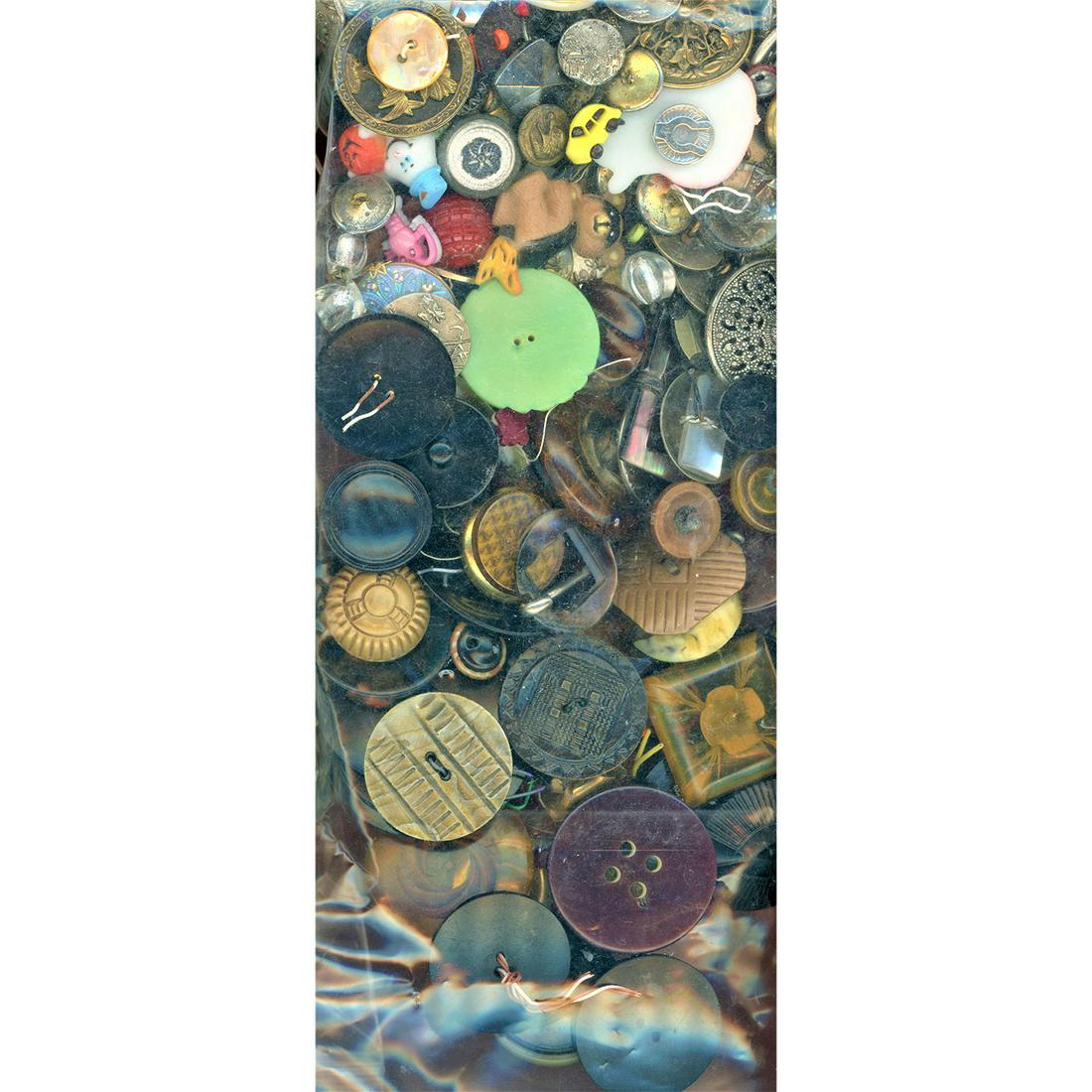 A BULGING BAG LOT OF ASSORTED MATERIALS IN BUTTONS (1 of 2)