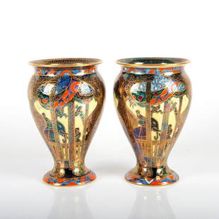 Wedgwood Lustre Vases, Lahore Pattern Z5266, Pair: Exceptionally decorated pair of rare vases on yellow lustre ground featuring elephants, attendants and giraffes. An extensive scene in colors of blues, yellows, oranges and purples; heightened with