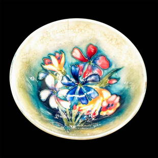 Moorcroft Pottery Miniature Bowl, Floral Waratah: Glazed ceramic with deep blue ground, green rim and inner walls with flowers in hues of red, yellow, blues and white. Moorcroft, Made in England, Potter to H.M. The Queen and William Moorcroft