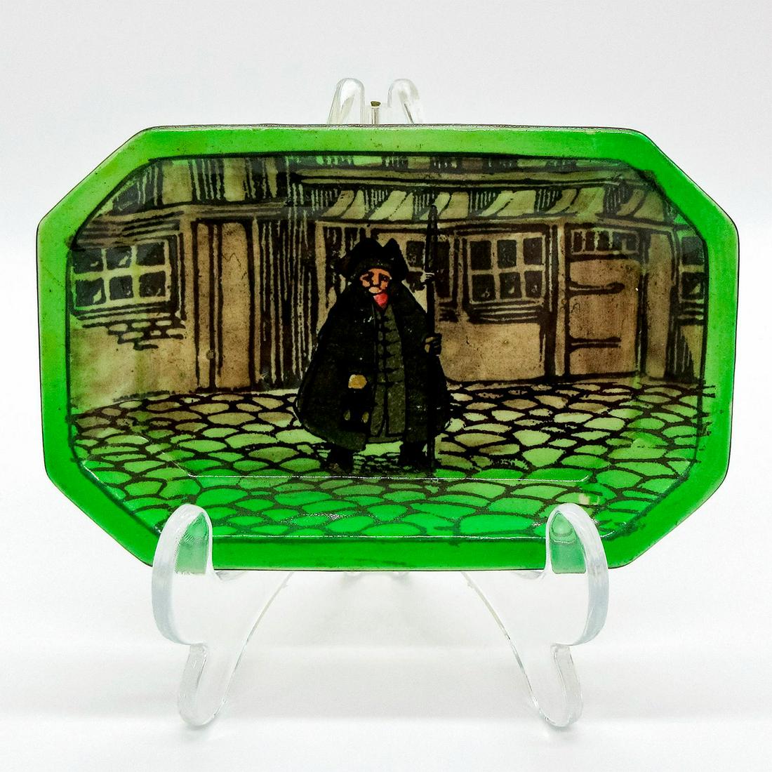 Royal Doulton Seriesware Ashtray, Nightwatchman D2002: Front view with stick and lantern vertical in left hand. Royal Doulton backstamp. #nightwatchman Issued: 1899 - 1945 Dimensions: 5"W x 0.5"H Manufacturer: Royal Doulton Country of Origin: England
