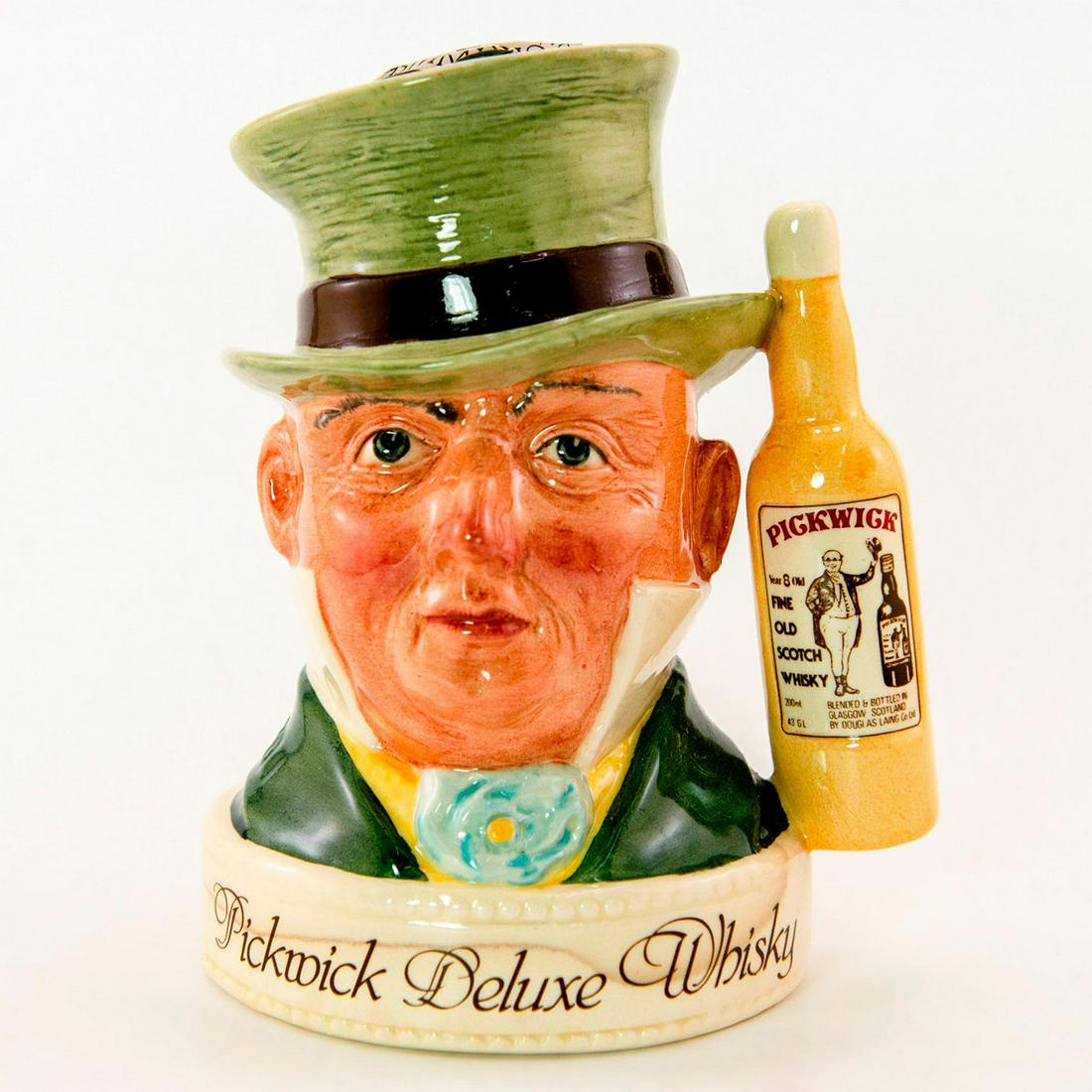 Royal Doulton Sealed Whisky Container, Mr. Micawber: Comes with original box and contains some liquid. Pickwick Deluxe Whisky. 8 Years old fine scotch whiskey. Royal Doulton backstamp. Good condition. Bottle measurements - 5.5"H. Artist: Harry Sales