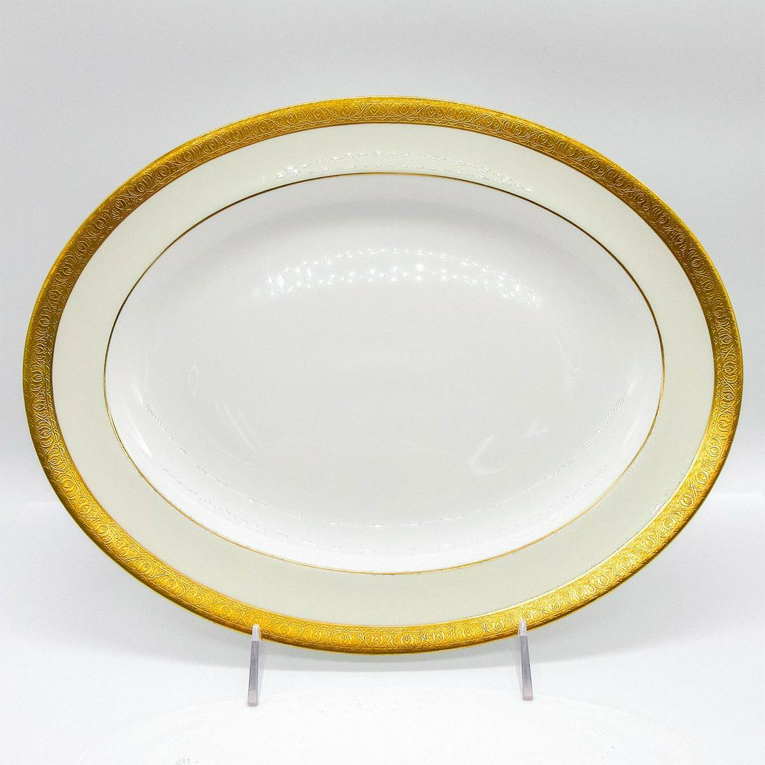 Minton Buckingham K-159, Medium Oval Serving Platter: Bone China. Gold encrusted edge, cream rim, and white center. Minton backstamp. #minton #bonechina #platter Issued: 1926 - 2009 Dimensions: 13.75"L x 10.75"W x 1.2"H Manufacturer: Minton Country of Or