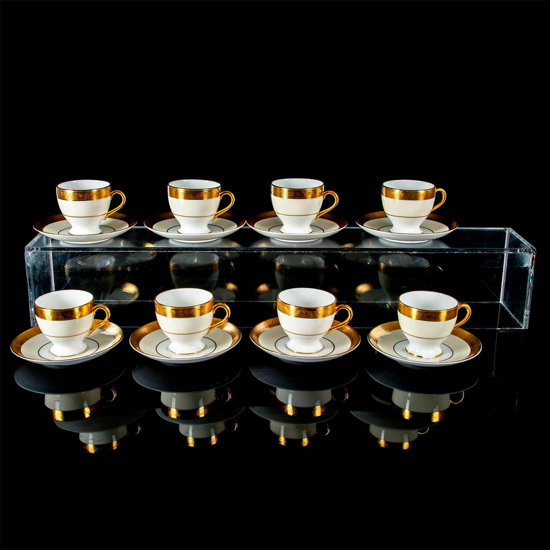16pc Minton Buckingham K-159, Demitasse Cup and Saucer Set: 8 cups and 8 saucers. Bone China. Gold encrusted edge, cream rim, and white center. Minton backstamp. Demitasse Cup: 2.4"H x 2.5"Diameter. Saucer: .75"H x 4.8"Diameter. Chipped base to one of the demi
