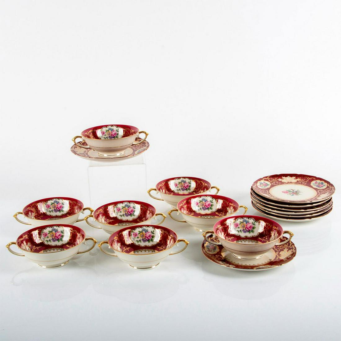 16pc F&B Bohemia Baronet Cream Soup Bowls and Saucer Set: For 8, twin handle with saucers designed with colorful flowers, red borders and gilded accents. Bowls 1.75"H x 5.25"D. Saucers 6.75"D. F&B Bohemia Baronet backstamp. Issued: 20th c. Manufacturer: F&B 