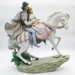 Love Story 01005991 - Lladro Porcelain Figurine with Base: Glossy porcelain. Lladro backstamp. Artist: Jose Puche Issued: 1993 - 2001 Dimensions: 14.25"H x 13.75"W Manufacturer: Lladro Country of Origin: Spain