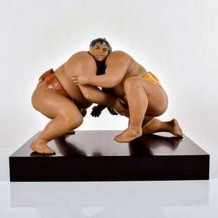 Test of Strength 1013574 - Lladro Porcelain Figurine: Limited edition 663 of 1,000. Gres finish; Two Japanese Sumo wrestlers. Comes with a base. Lladro backstamp. Artist: Miguel Angel Santaeulalia Issued: 1995-2003 Dimensions: 9.5"H x 16.25"W Manufacture