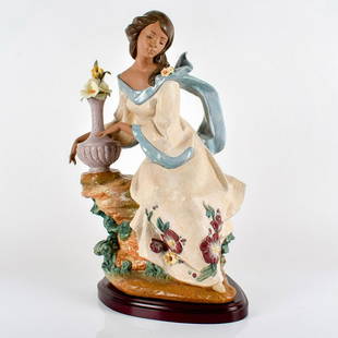 Garden Breeze 1013583 - Lladro Porcelain Figurine: Gres finish, includes wooden base. Lladro backstamp, signed by artist on bottom. Includes framed certificate. Artist: Francisco Polope Issued: 2001-2003 Dimensions: 23.5"H x 16.5"W Edition Number: