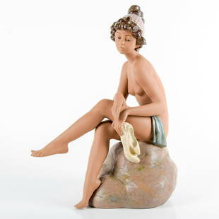 Daydreamer 1012182 - Lladro Porcelain Figurine: Gres porcelain. Lladro backstamp. Artist: Salvador Debon Issued: 1988 - 2005 Dimensions: 20"H x 13.5"W Manufacturer: Lladro Country of Origin: Spain