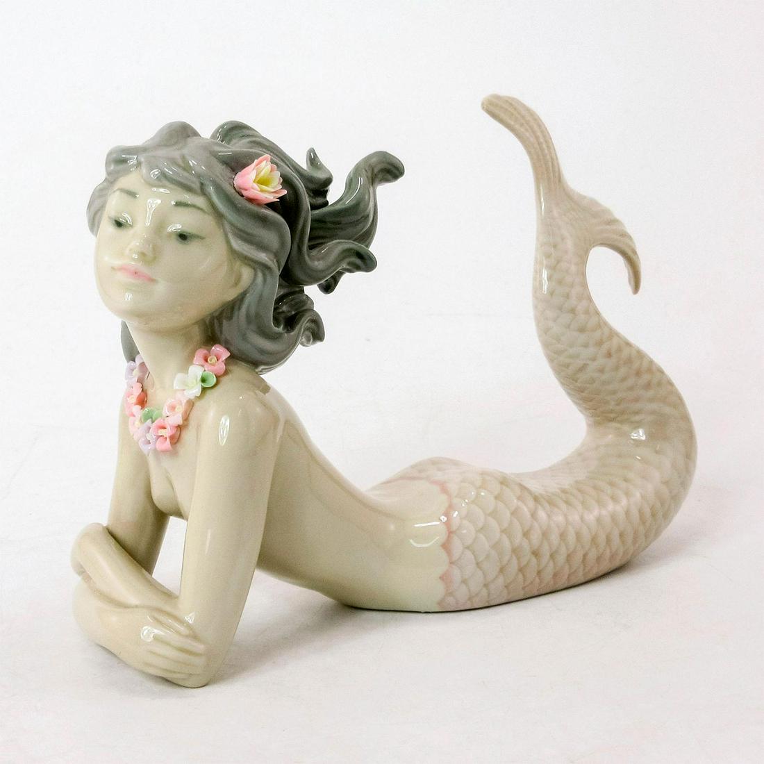 Fantasy 1001414 - Lladro Porcelain Figurine: Glossy porcelain. Lladro backstamp. Artist: Jose Puche Issued: 1982 - 2017 Dimensions: 5"H x 6.25"W Manufacturer: Lladro Country of Origin: Spain