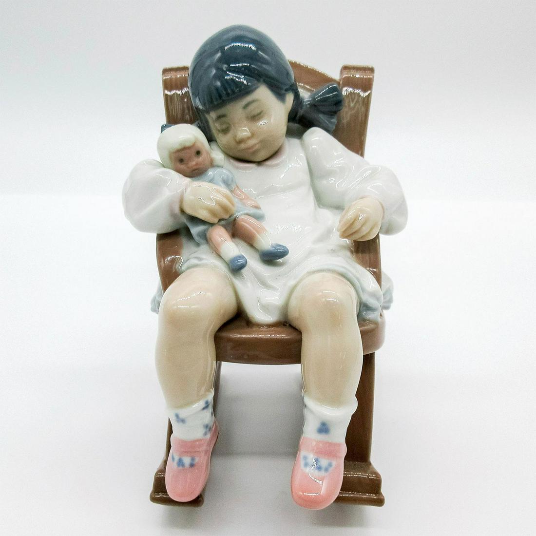 Naptime 1005448 - Lladro Porcelain Figurine: Glossy porcelain. Lladro backstamp. Artist: Jose Puche Issued: 1987-2004 Dimensions: 4.75"H x 4.75"W Manufacturer: Lladro Country of Origin: Spain