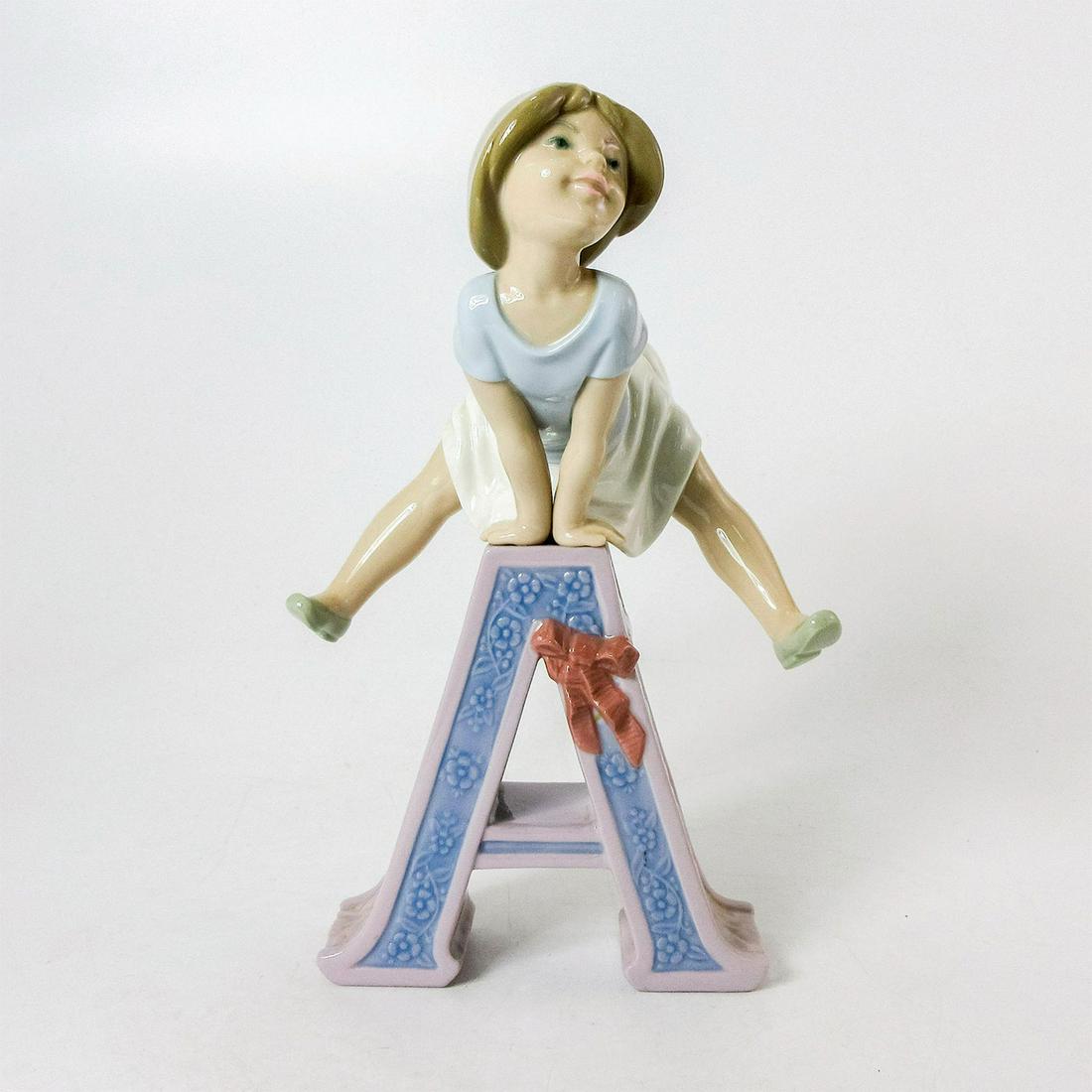 Schoolgirl A 1005145 - Lladro Porcelain Figurine: Glossy porcelain. Lladro backstamp. Artist: Jose Puche Issued: 1982-1985 Dimensions: 8.25"H Manufacturer: Lladro Country of Origin: Spain