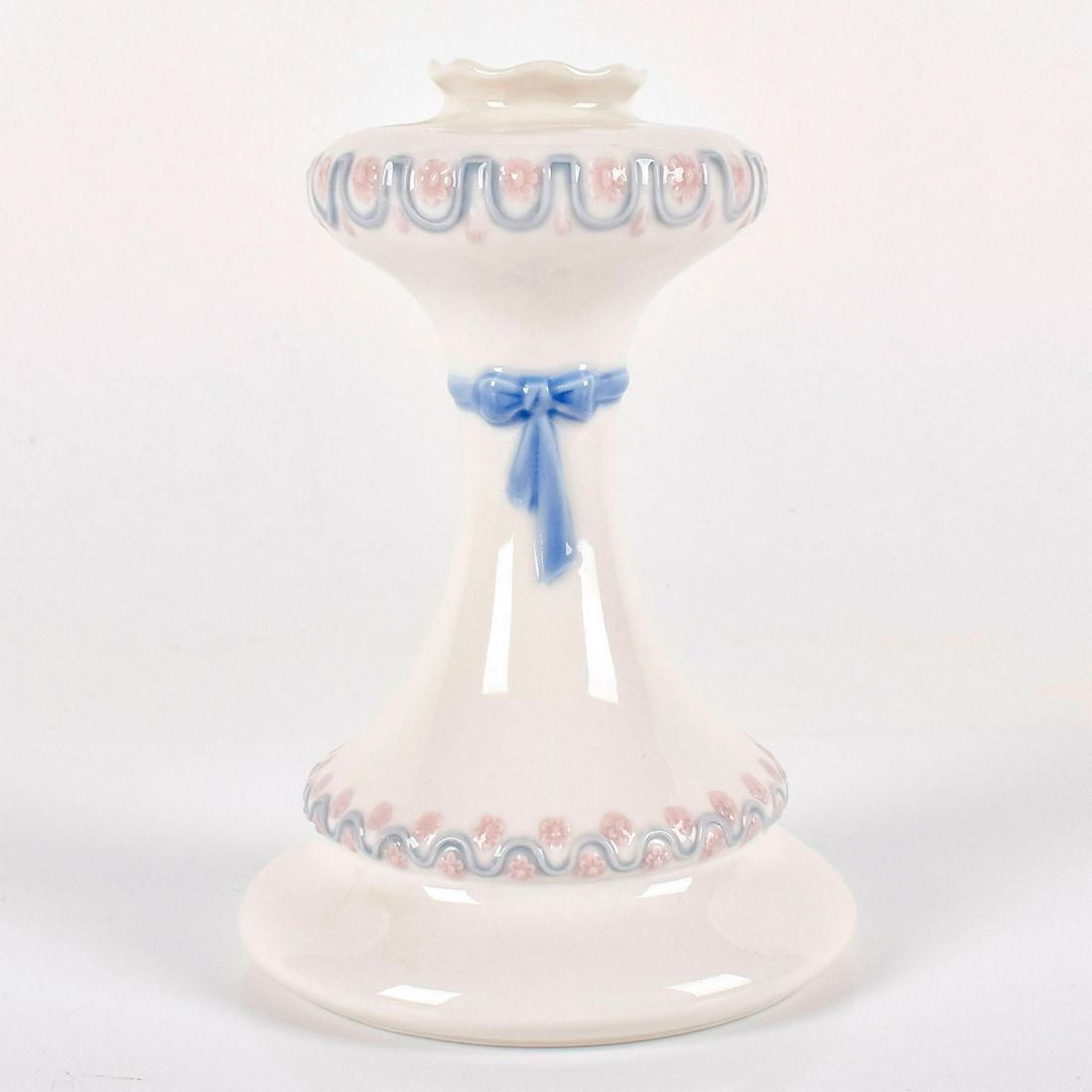 Candleholder 1005625 - Lladro Porcelain: Glossy finish, Lladro backstamp. Artist: Julio Ruiz Issued: 1989-1990 Dimensions: 6"H Manufacturer: Lladro Country of Origin: Spain
