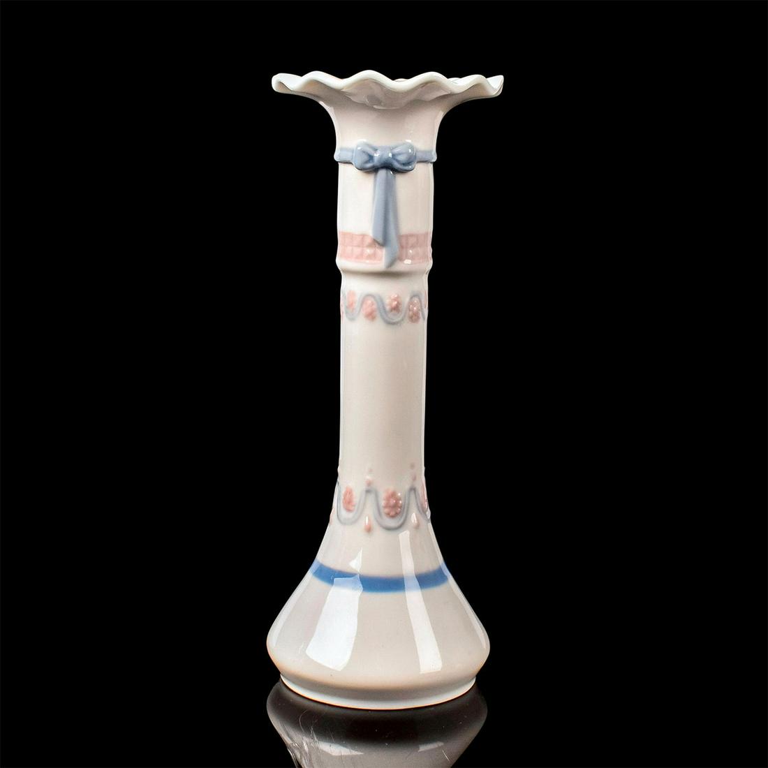 Candleholder 1005628 - Lladro Porcelain: Glossy finish, Lladro backstamp. Artist: Julio Ruiz Issued: 1989-1990 Dimensions: 6"H Manufacturer: Lladro Country of Origin: Spain