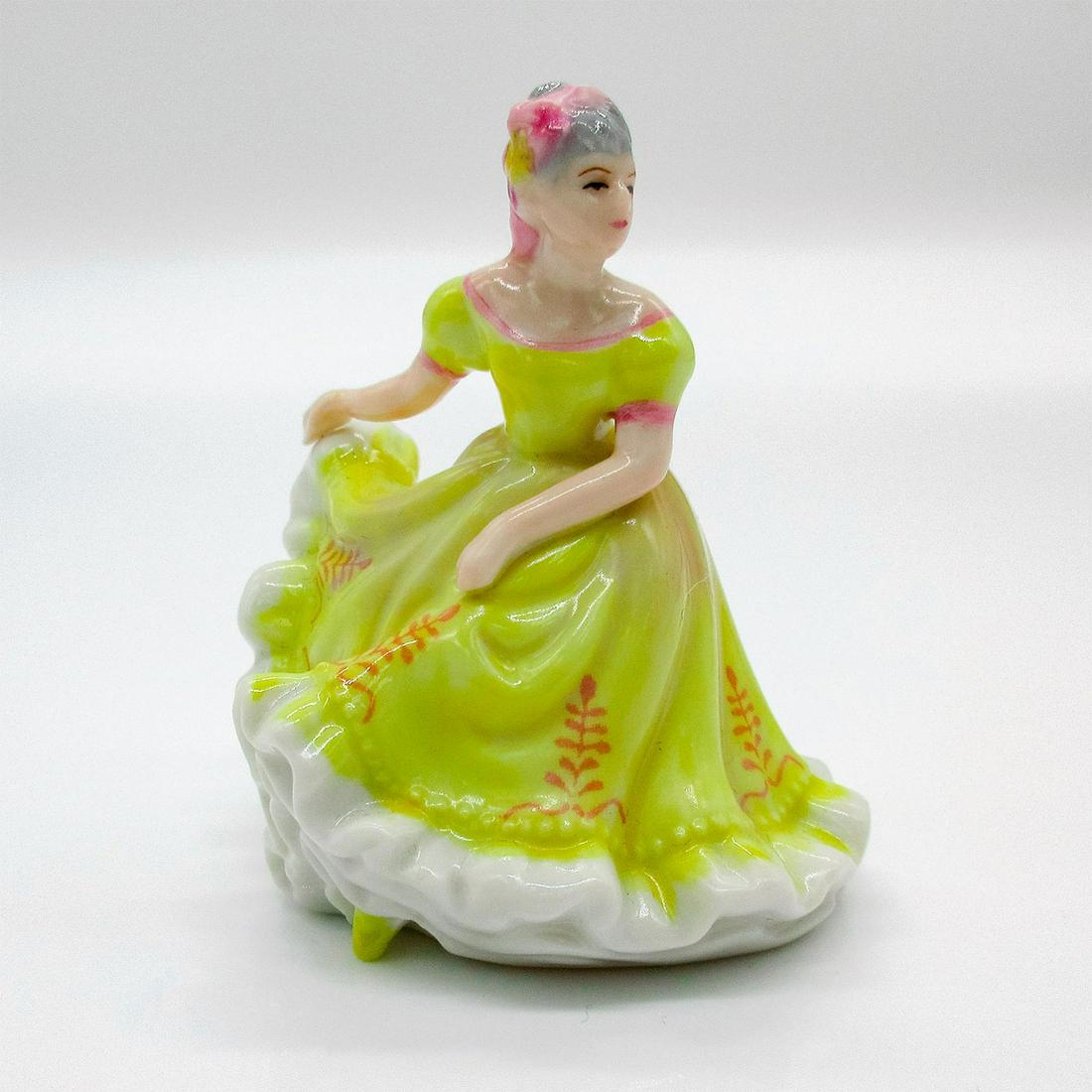 Ninnette M206 - Royal Doulton Figurine: Glazed, hand painted bone china miniature. Pretty lady is in a yellow dress with pink floral design, and a pink ribbon in her hair. Series: Miniature - New Pretty Ladies. Royal Doulton backstamp. Arti