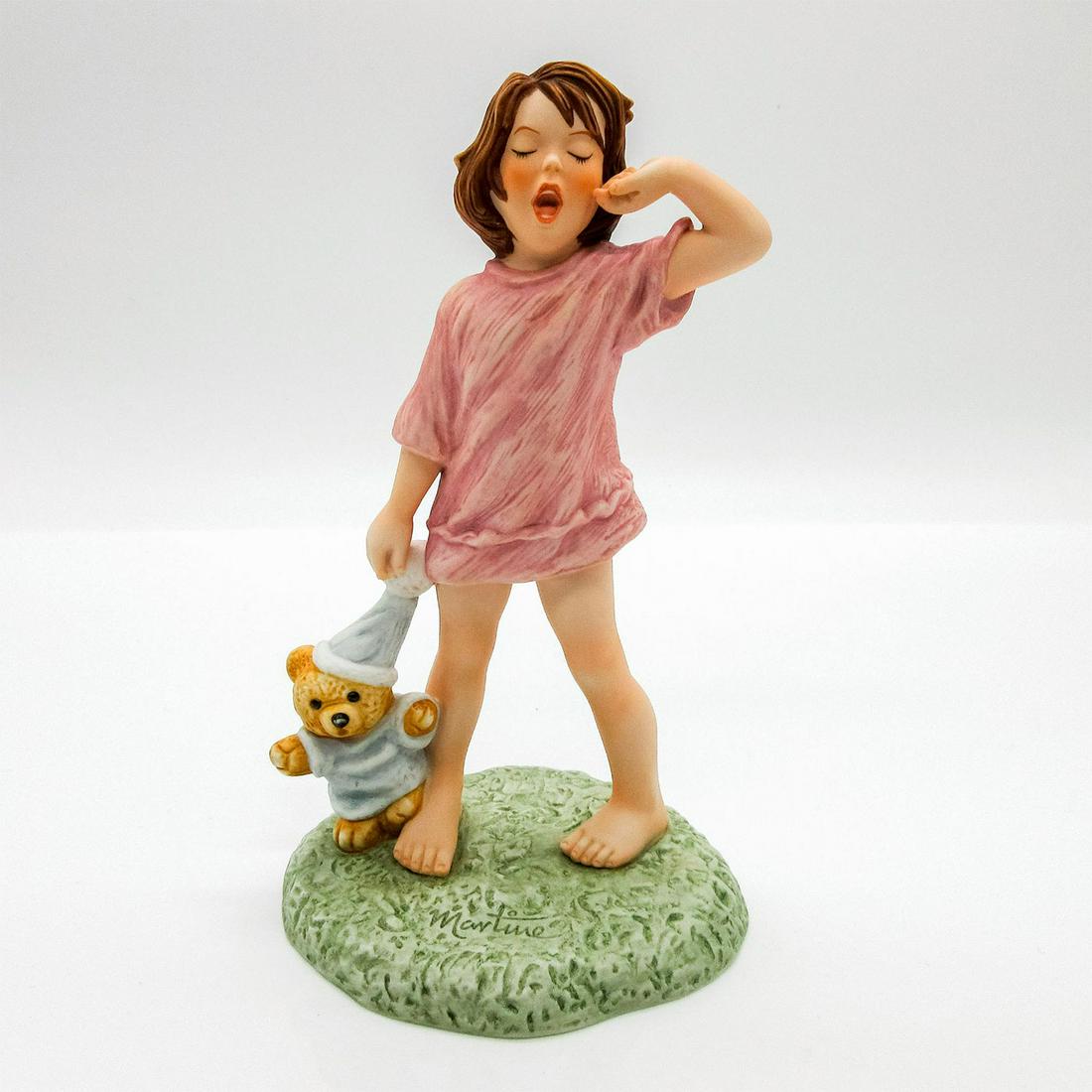 Goebel Martine Figurine, So Tired: Matte hand painted porcelain featuring brunette girl yawning in lilac nightgown while holding a teddy. Martine impressed on base. Goebel backstamp on bottom. #martime #porcelain Artist: Marcel Marlier