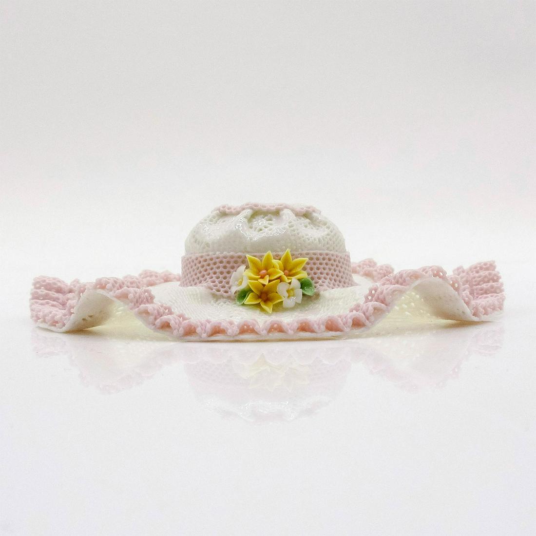 Small Pink Hat w/Ridges 1001564 - Lladro Porcelain Decor: Capricho finish; Lladro backstamp on bottom. Elegant miniature lace hat with pink bow. Artist: Design & Decoration Dept. Issued: 1987-1991 Dimensions: 1"H Manufacturer: Lladro Country of Origin: Spain