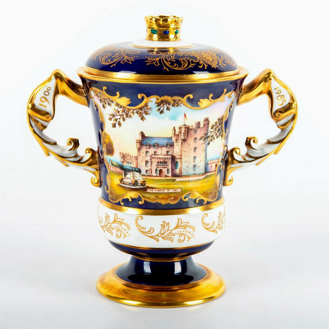 Aynsley China Lidded Vase, Queen Elizabeth, Castle of Mey: Peter Jones Collection; ltd edition 26 of 250. To commemorate the 85th birthday of Queen Elizabeth, the Queen Mother. Double handled; footed base; cover. Hand painted panel of the Castle of Mey by R.